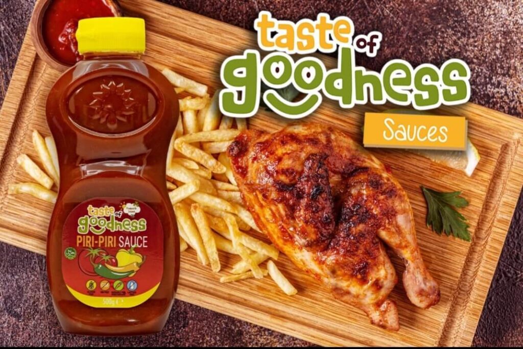 bottle of Taste of goodness piri piri sauce alongside chicken and chips