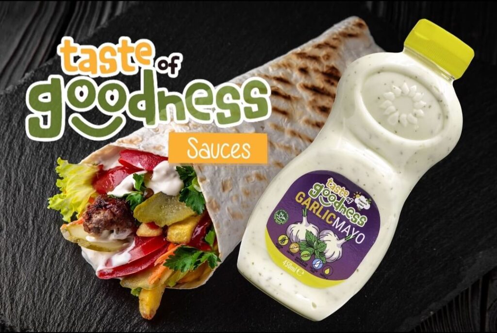 Bottle of taste of goodness garlic mayo alongside a wrap