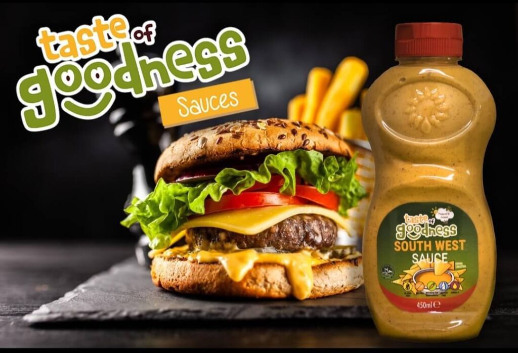 bottle of taste of goodness south west sauce alongside a burger